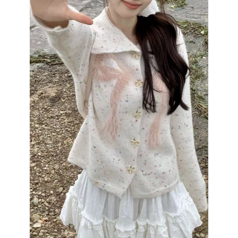 Women’s playful knitted vest with decorative button details and fluffy applications Lune London