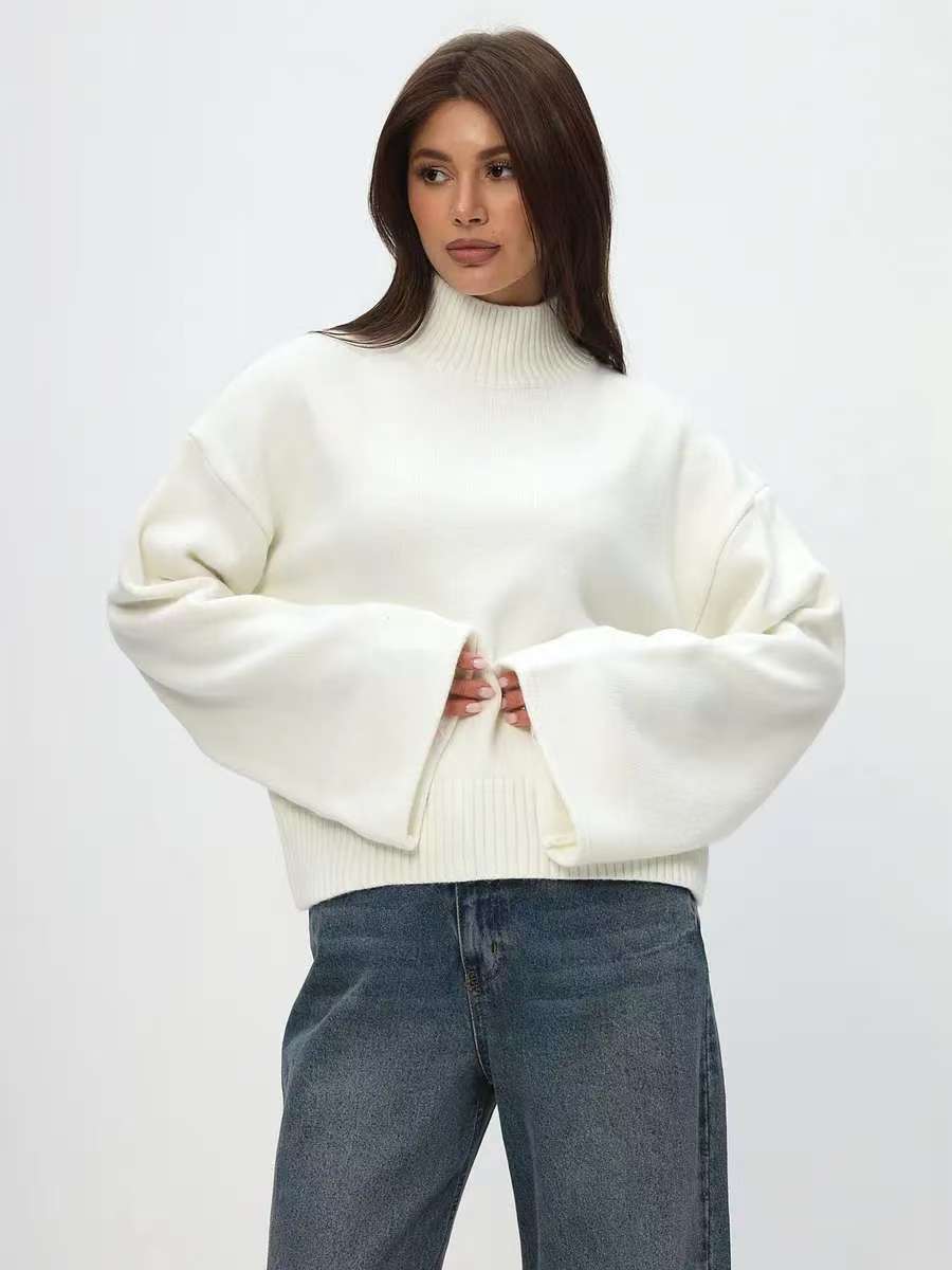 Trendy oversized knit sweater for women with wide sleeves and a high collar Lune London