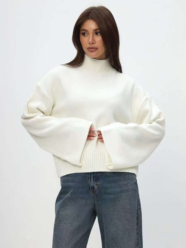 Trendy oversized knit sweater for women with wide sleeves and a high collar Lune London