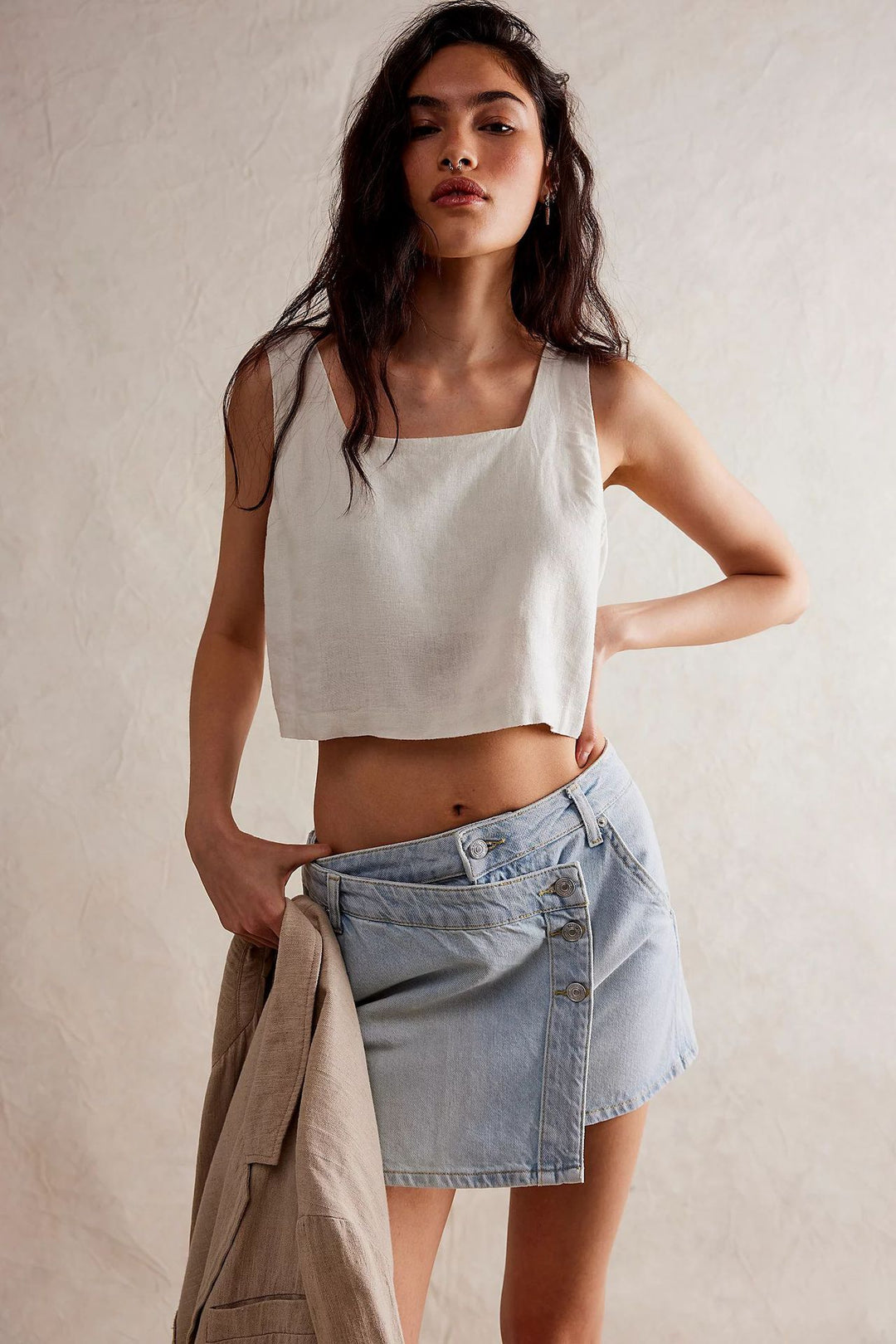 Women's fashionable A-line denim skirt with asymmetric button design and practical pockets Lune London