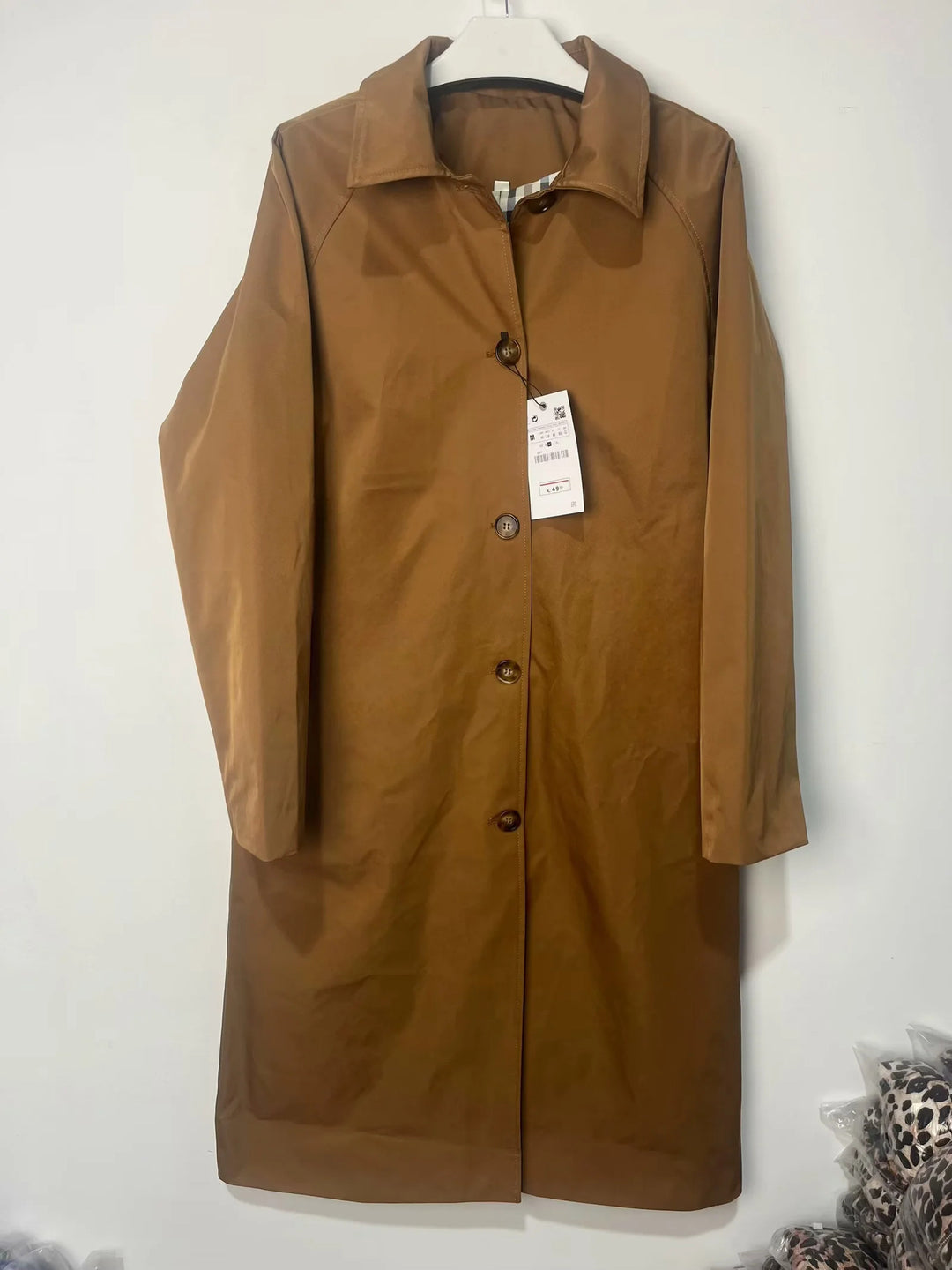 Transitional jacket for women with elegant high collar and practical button details Lune London