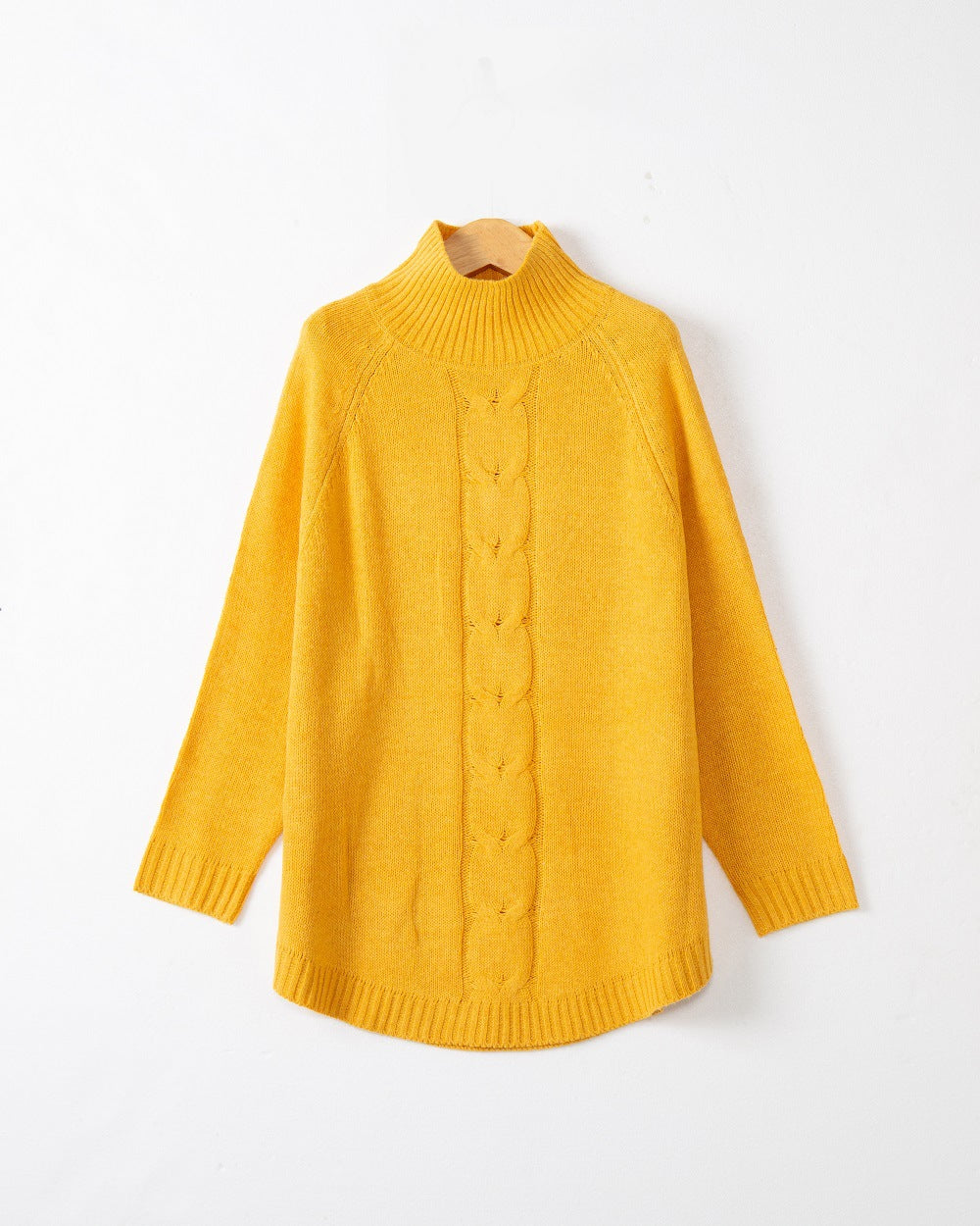 Chunky knit sweater for women with a high collar and cable patterns Lune London