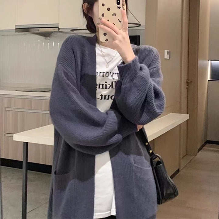 Ladies Long Knit Cardigan with practical pockets and chic elegant silhouette