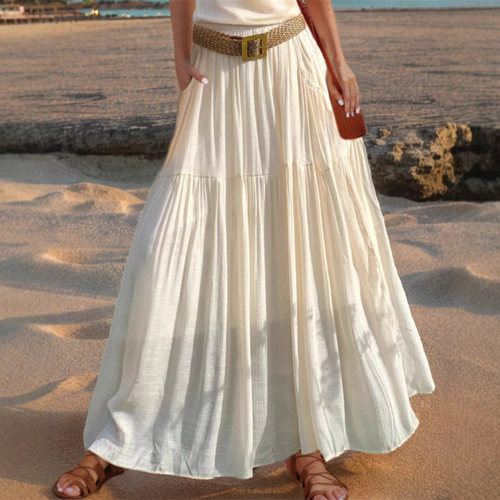 Maxi flared skirt for women with elegant pleated draping and practical pockets Lune London