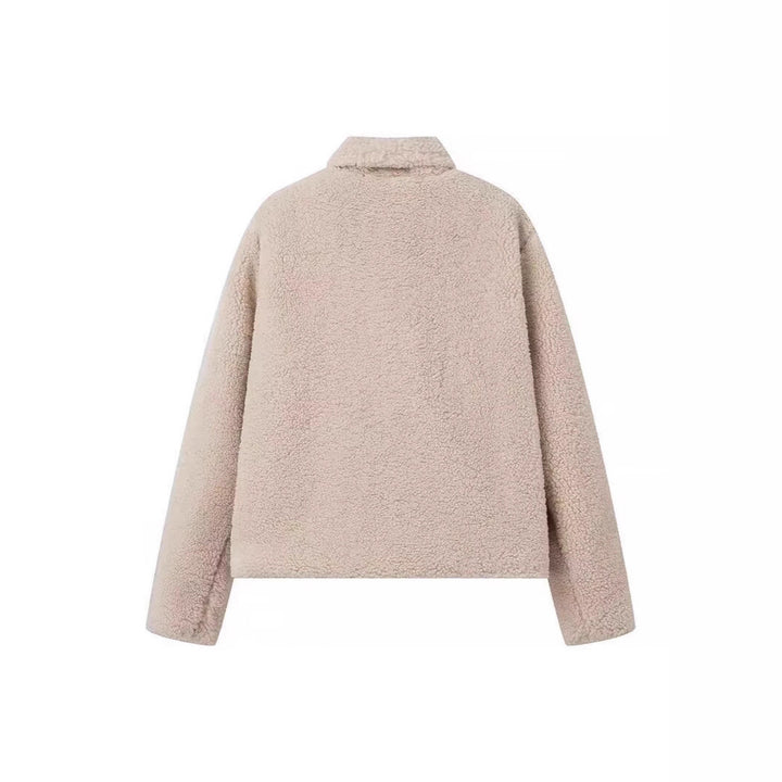 Veste en polaire confortable pour femmes avec des revers élégants et des poches pratiques Chic & Stil