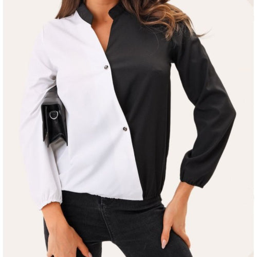 Trendy women's blouse with an asymmetrical color design and chic division seams style