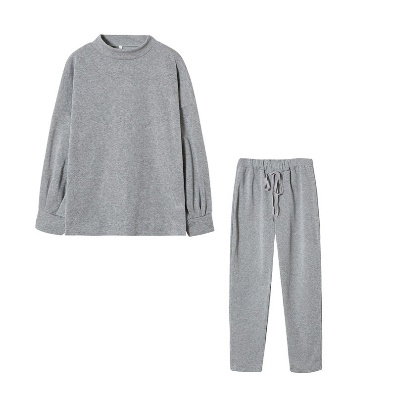 Ensemble de survêtement pour femmes avec une coupe moderne, un haut à col montant et un pantalon élastique Chic & Stil