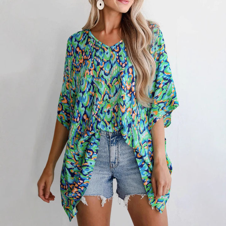 Casual beach blouse for women with an asymmetrical cut and colorful pattern Lune London