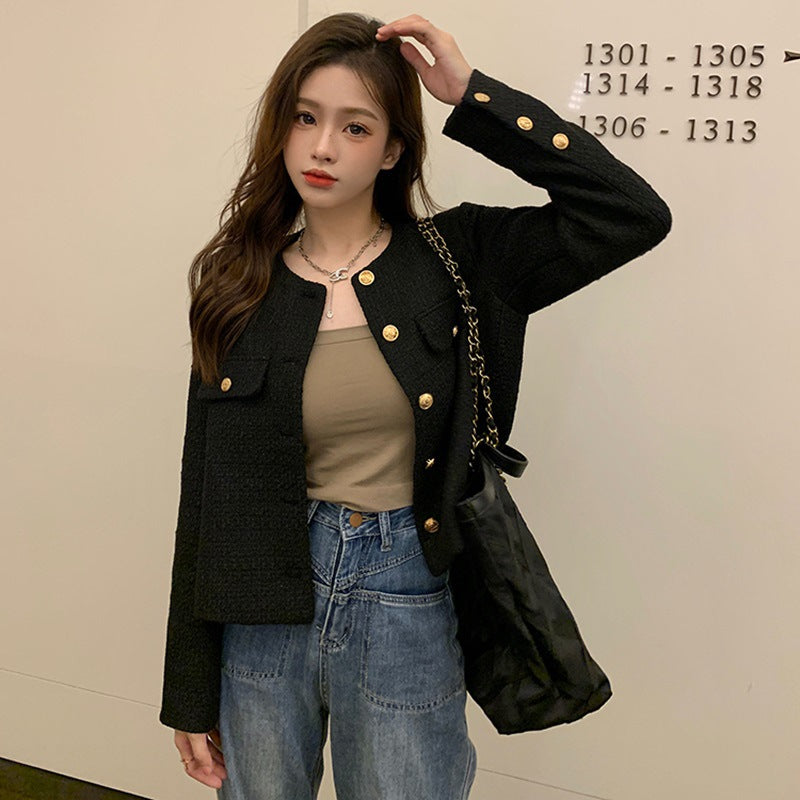 Women's short blazer with elegant gold buttons and modern cut