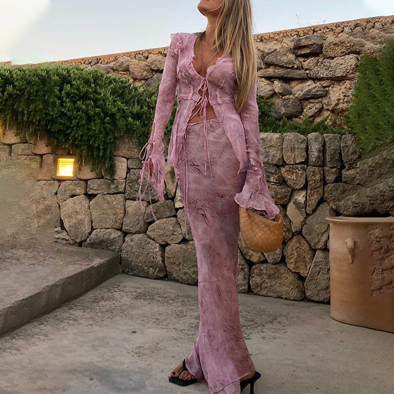Elegant maxi dresses with cutouts for women featuring fluid fabric and refined ruffle details Lune London