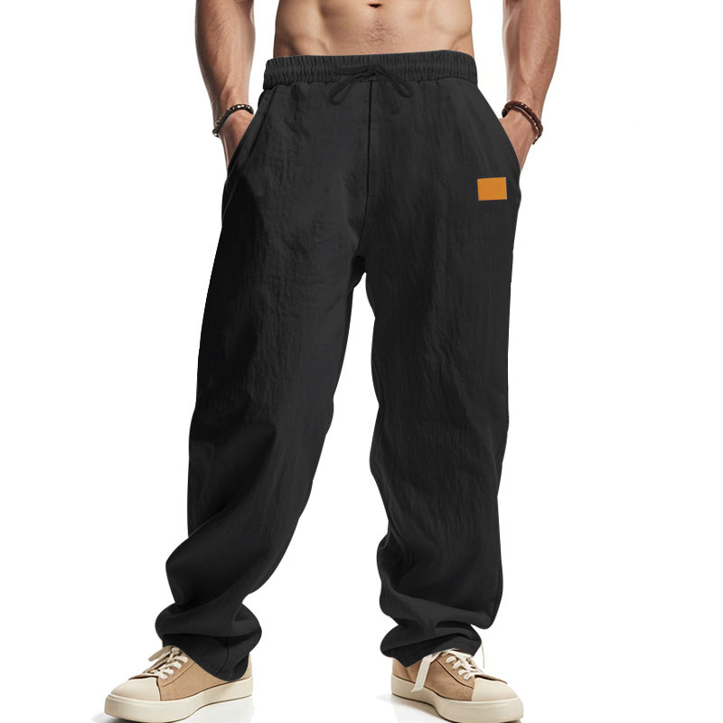 Linen pants for men with a relaxed fit featuring an adjustable drawstring and practical side pockets Lune London