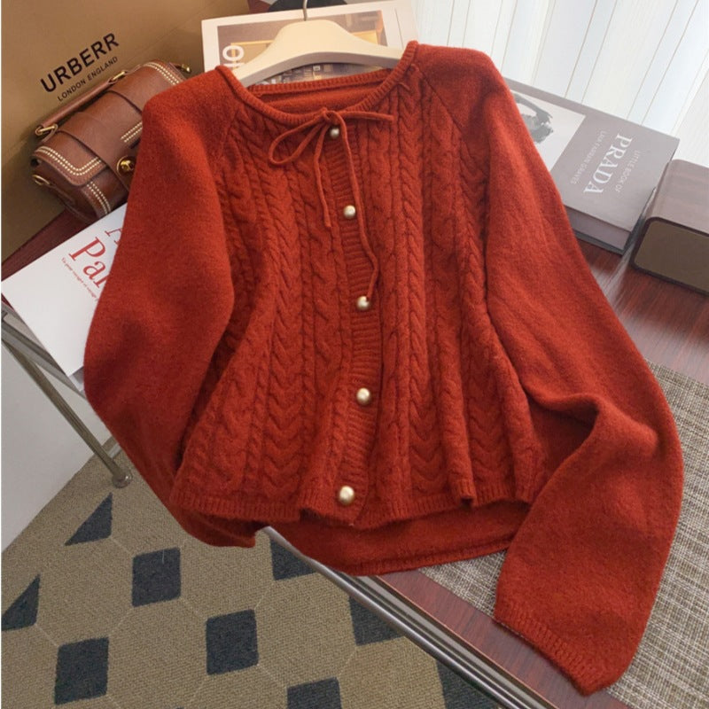 Women’s knitted jacket with embossed pattern and decorative button details Lune London