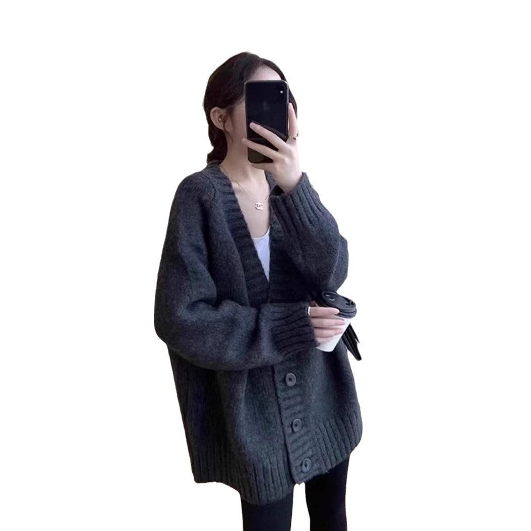 Oversized knitted jacket for women with a deep V-neck and button details Lune London