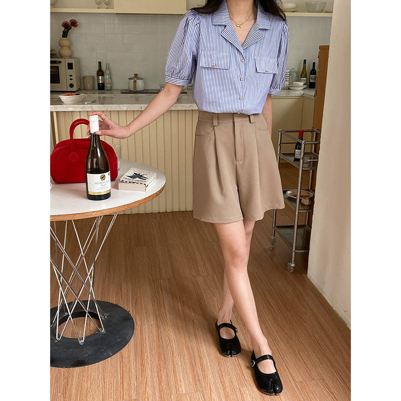 Women's short sleeve blouse with subtle striped pattern and decorative button details Chic & Stil