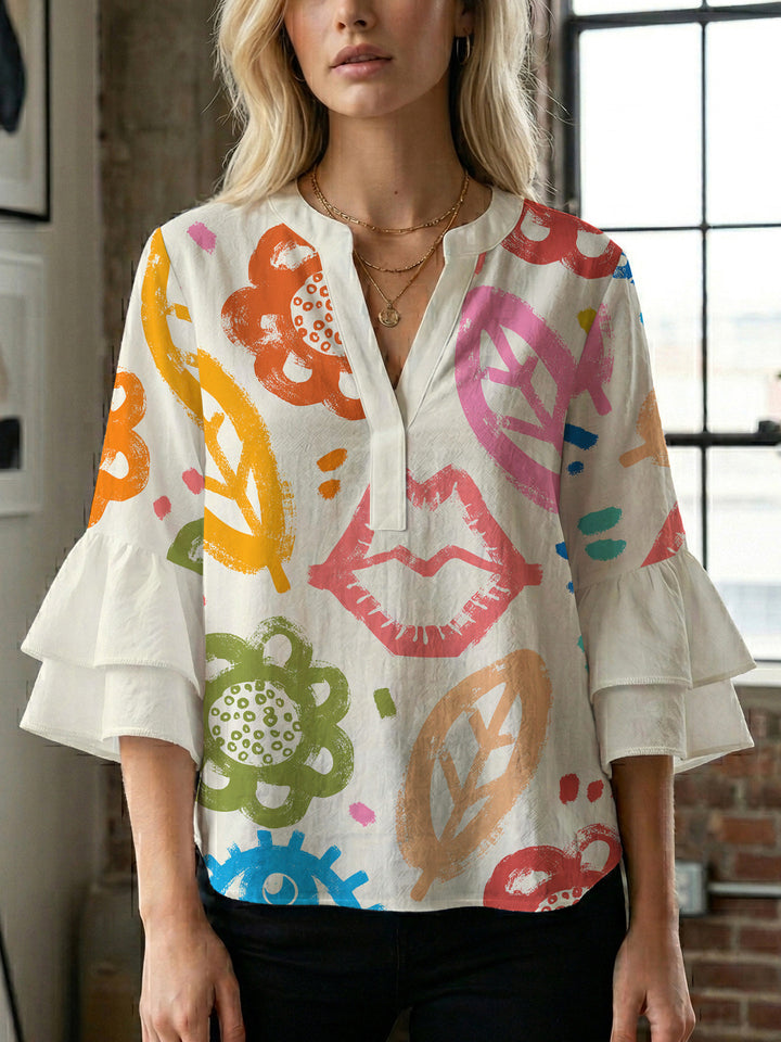 Women’s blouse with voluminous ruffled sleeves and floral pattern Lune London