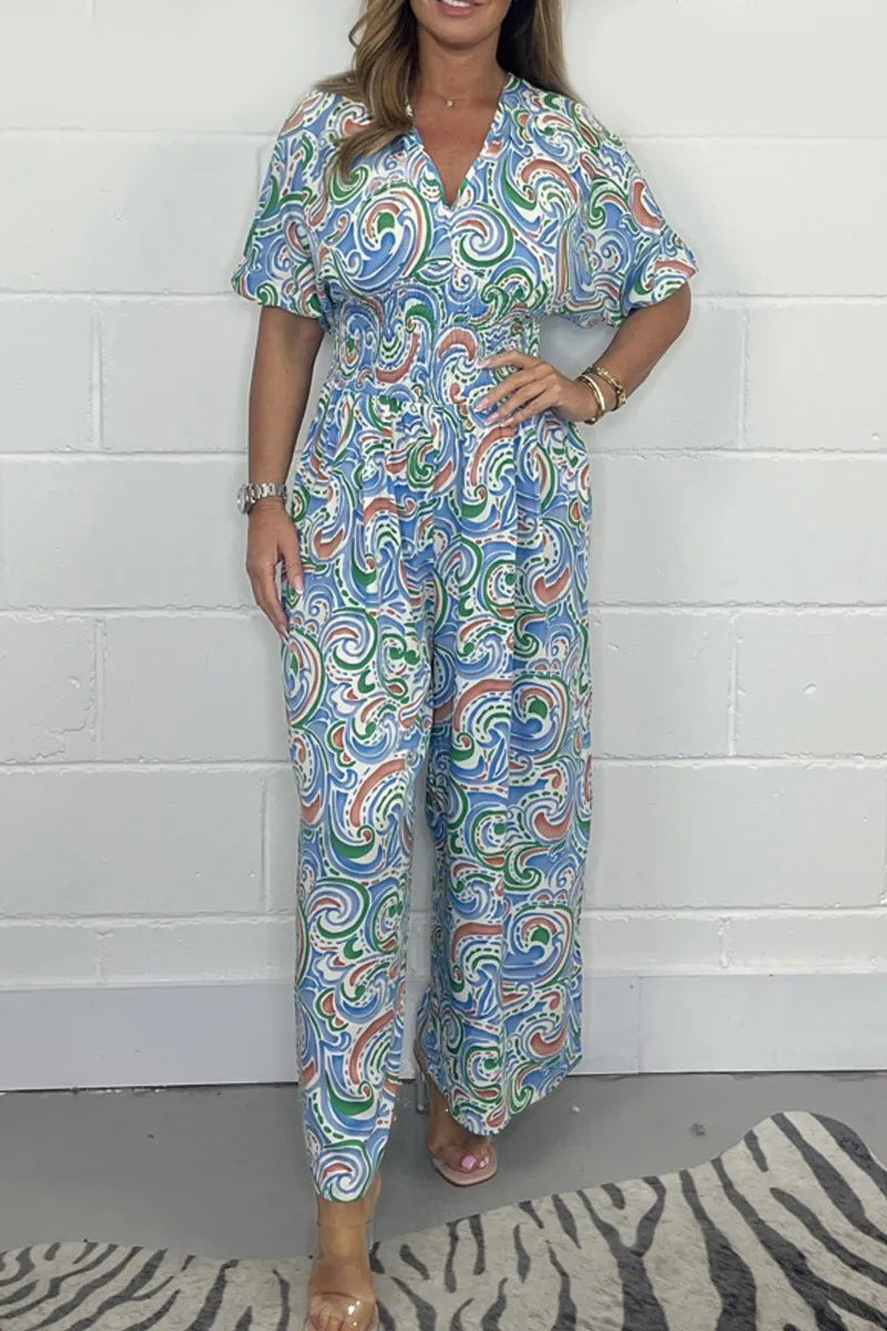 Lady Fluid jumpsuit with elegant paisley pattern and Lune London cinching