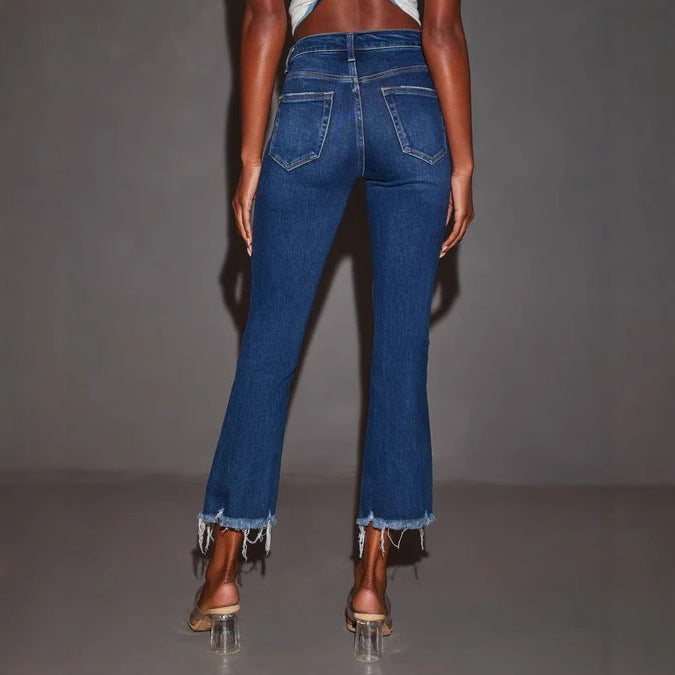 Women's flared jeans with trendy destroyed details and frayed hems
