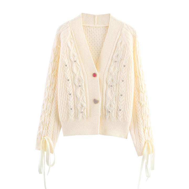 Knitted jacket for women with cable pattern and decorative button details Lune London