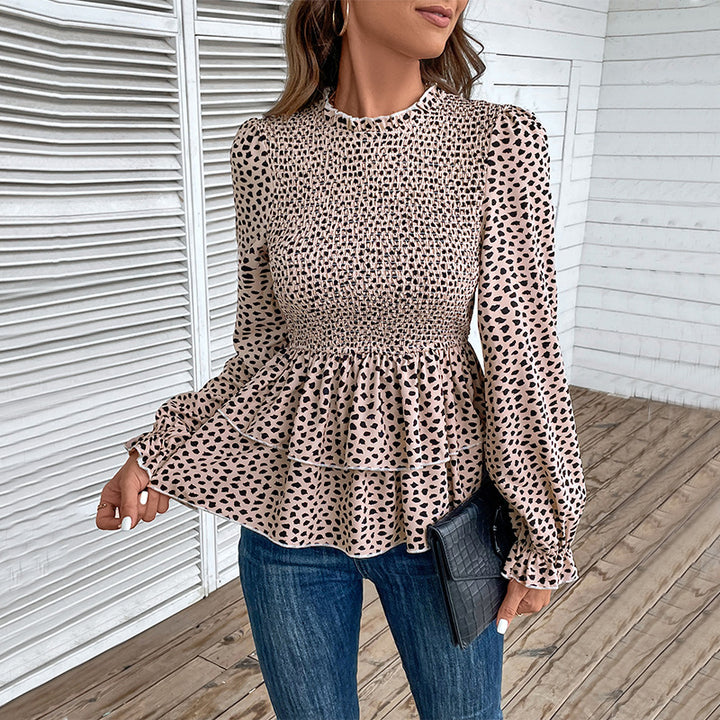 Women’s blouse with extravagant gathered details and a chic polka dot pattern