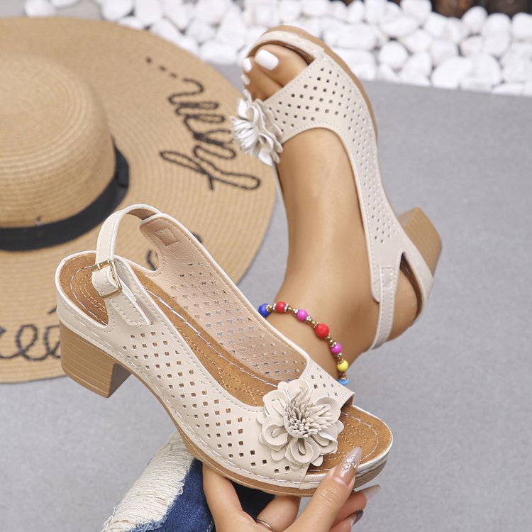 Women's clogs with a decorative floral detail and a perforated surface Lune London