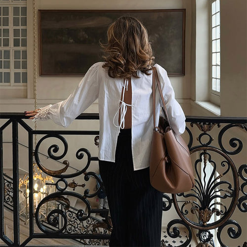 Blouse for women with elegant lace accents and puff sleeves Lune London