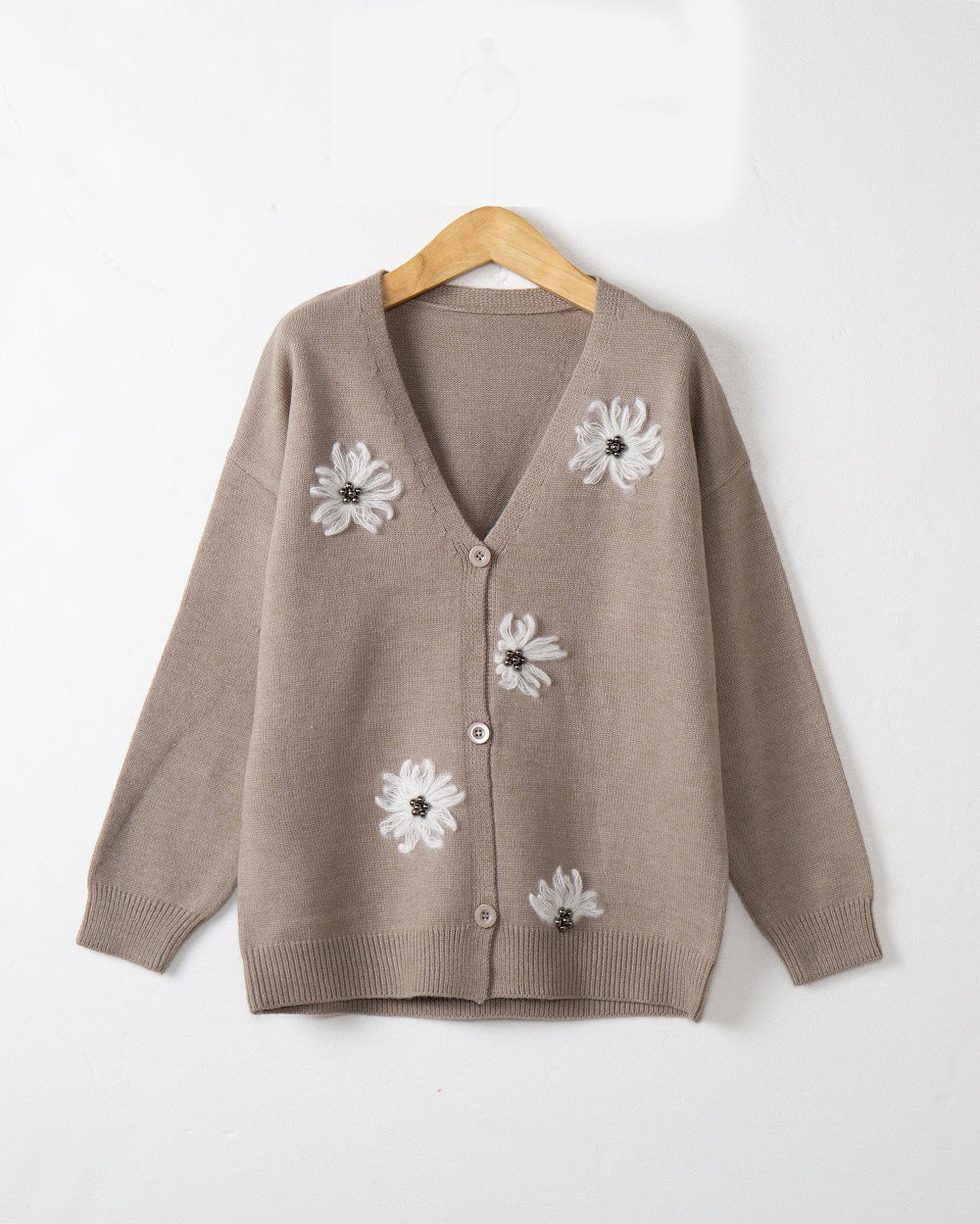 Women’s knitted jacket with floral pattern and elegant button placket Lune London