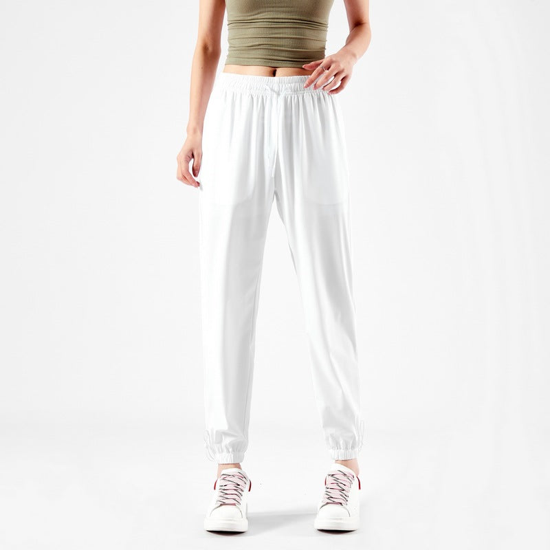 Light sport pants for women with elastic waist and practical pockets Lune London
