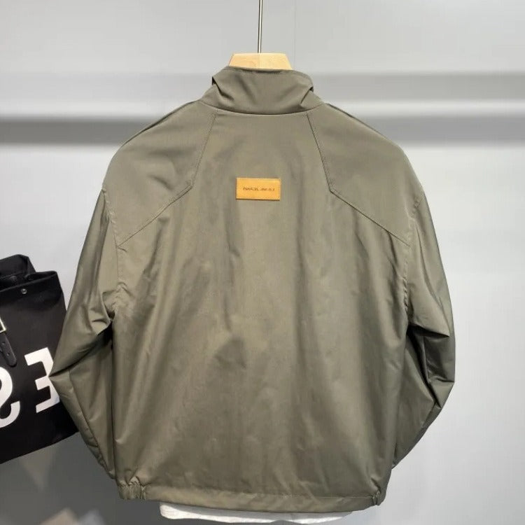 Durable transition jacket for men with practical pocket arrangement and adjustable collar Lune London
