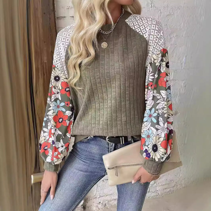 Women's sweater with a playful shape featuring a chic floral sleeve design