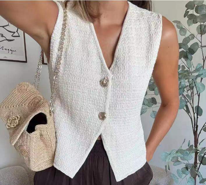 Ladies sleeveless cardigan with decorative buttons and beautiful texture Lune London