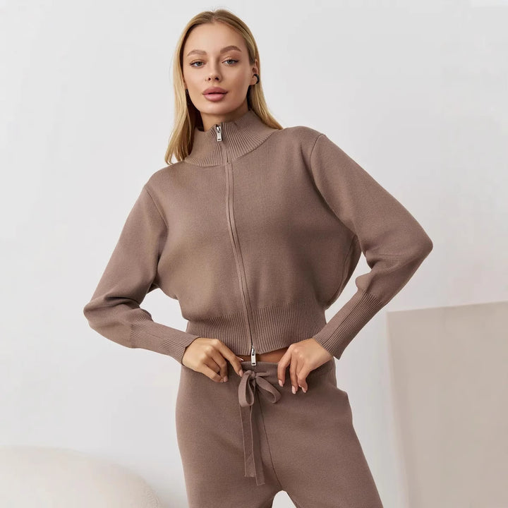 Ladies comfortable knit jumpsuit with high collar and side lace details Lune London
