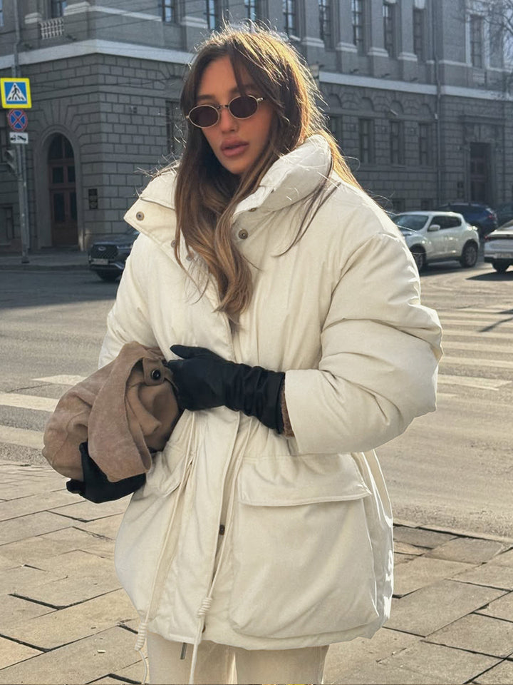 Quilted winter jacket for women with high collar and practical drawstring waist Lune London