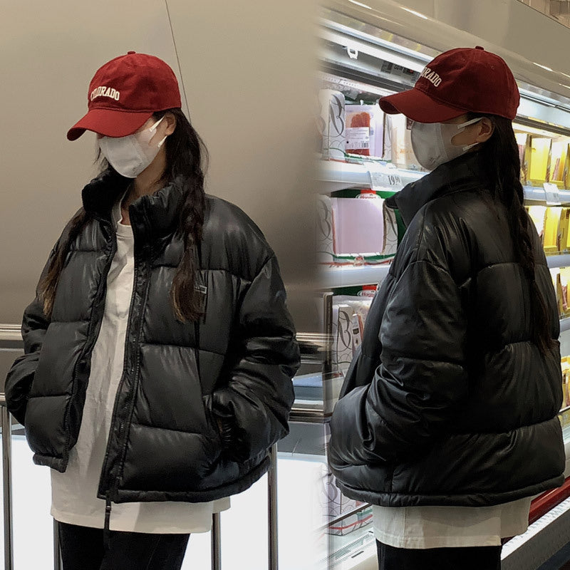 Trendy winter jacket for women with a high collar and zippered side pockets.