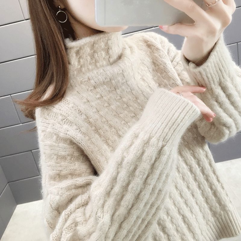 Knitted sweater for women with a modern ribbed design featuring a high collar and relaxed sleeves Lune London