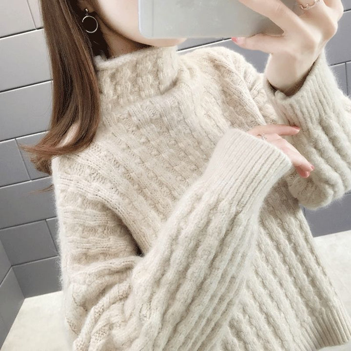 Knitted sweater for women with a modern ribbed design featuring a high collar and relaxed sleeves Lune London