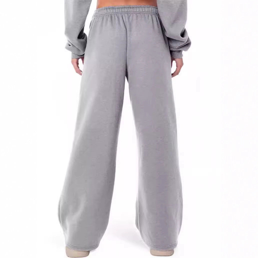 Women's loose-fitting leisure pants with elastic waistband and side pockets Chic & Stil