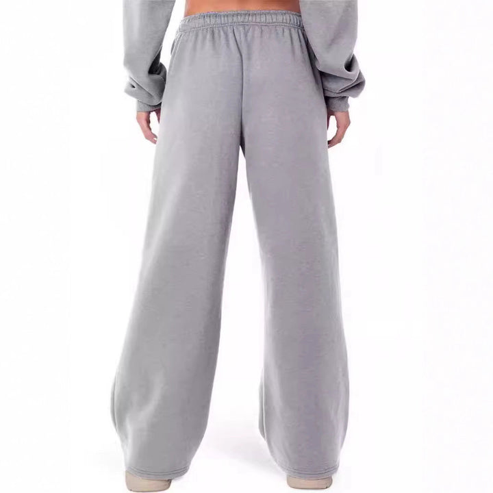Women's loose-fitting leisure pants with elastic waistband and side pockets Chic & Stil