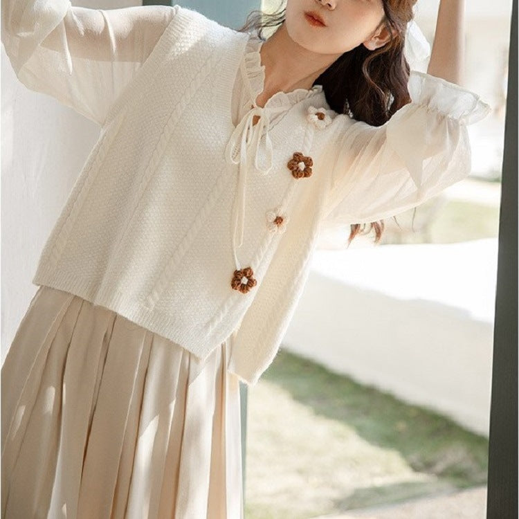 Ladies chunky knit cardigan with V-neckline and floral accents Lune London