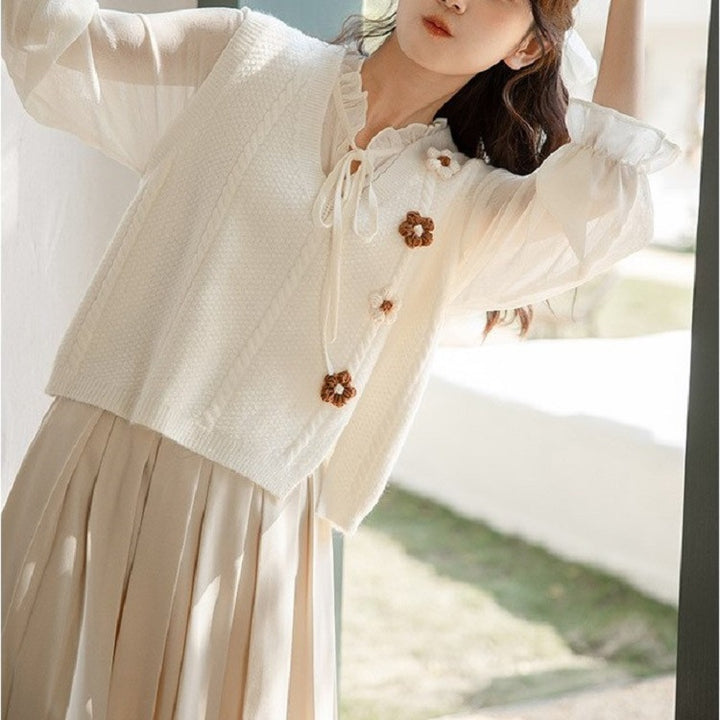 Ladies chunky knit cardigan with V-neckline and floral accents Lune London