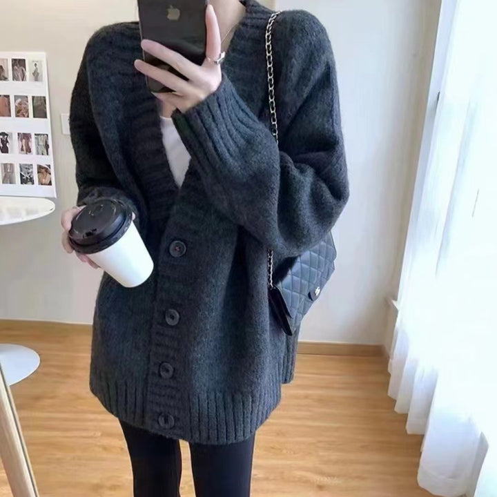 Oversized knitted jacket for women with a deep V-neck and button details Lune London