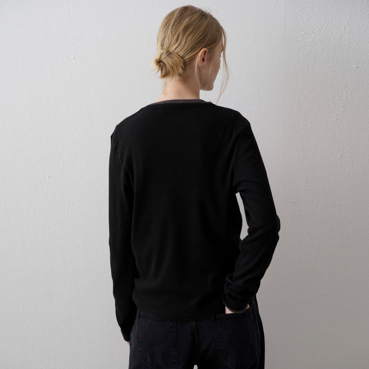 Knitted tank top for women with asymmetric button closure and long sleeve cuffs Lune London