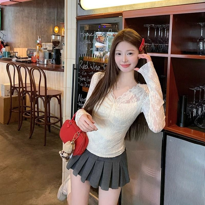 Women's lace blouse with V-neck and ruffle details Chic & Stil