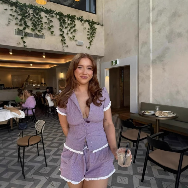 Women's pajama set with ruffle details and button-up top Lune London