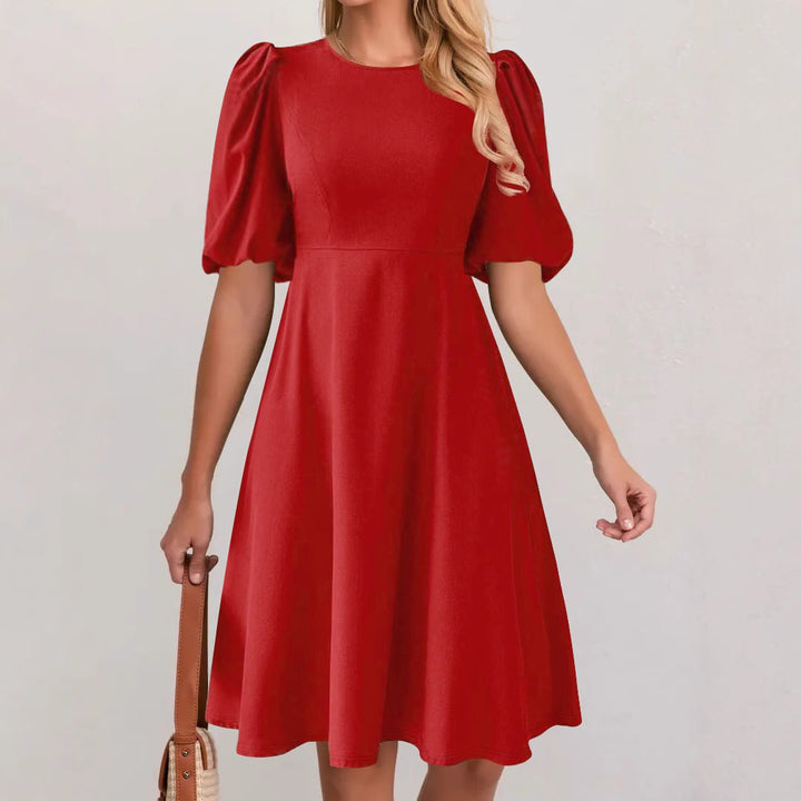 Puff sleeve dress for women with a flowing cut and waist accentuation Lune London