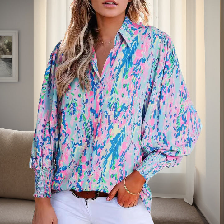 Shirt blouse for women with a vibrant floral design featuring off-shoulder and elastic cuffs Lune London