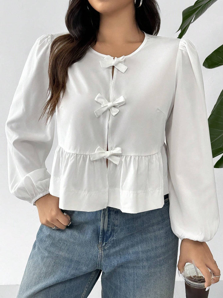 Women’s blouse with romantic ruffle details and a bow Lune London