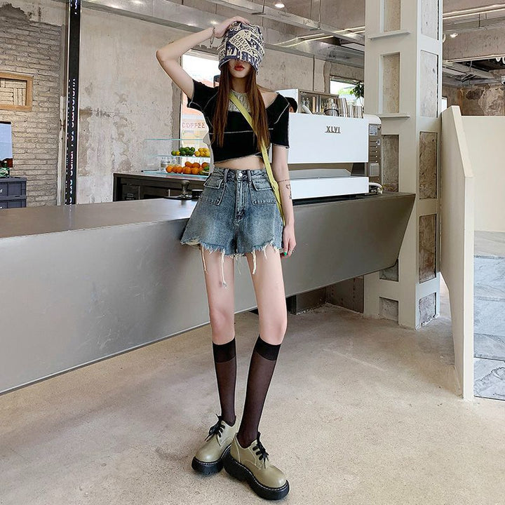 Women's denim shorts with frayed hems and unique embroidery detail Lune London