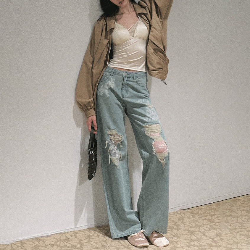 Women's wide cut jeans with individual destroyed details and floral print Lune London
