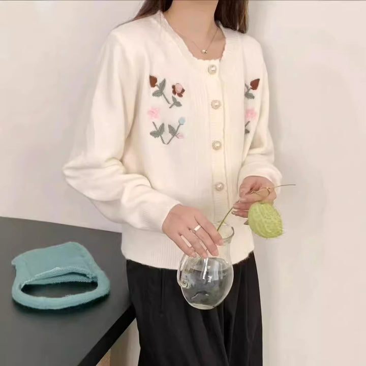 Women’s playful knitted vest with raised floral pattern and elegant pearl buttons Lune London
