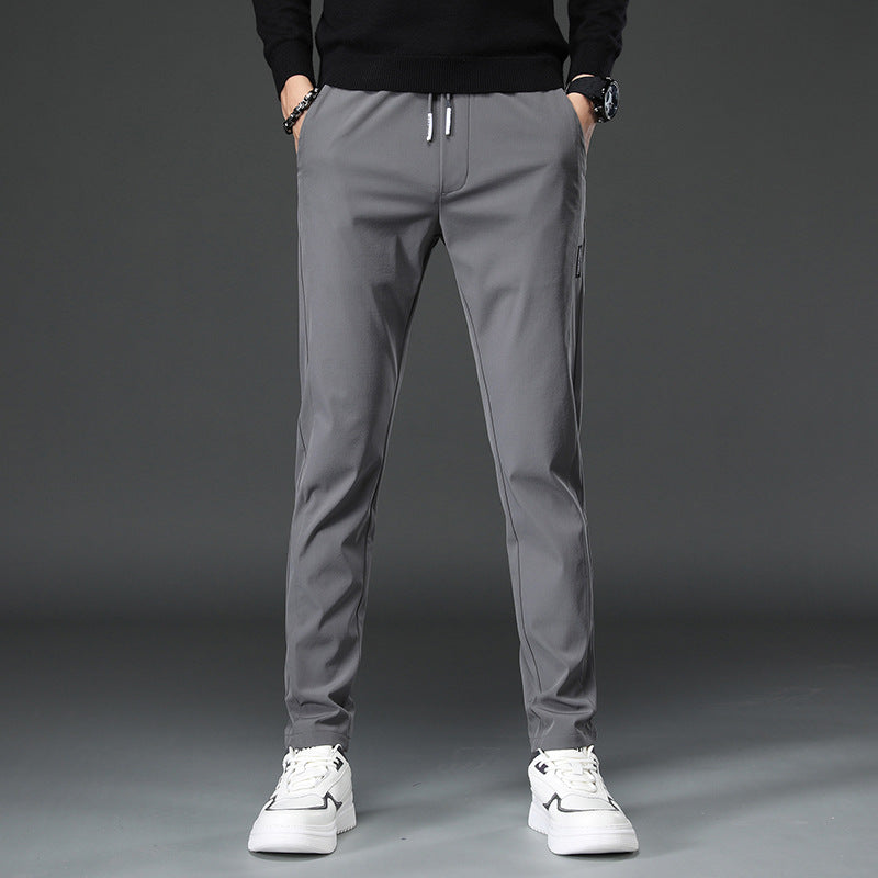 Men's slim fit sports pants with elastic waistband and practical zip pockets Lune London